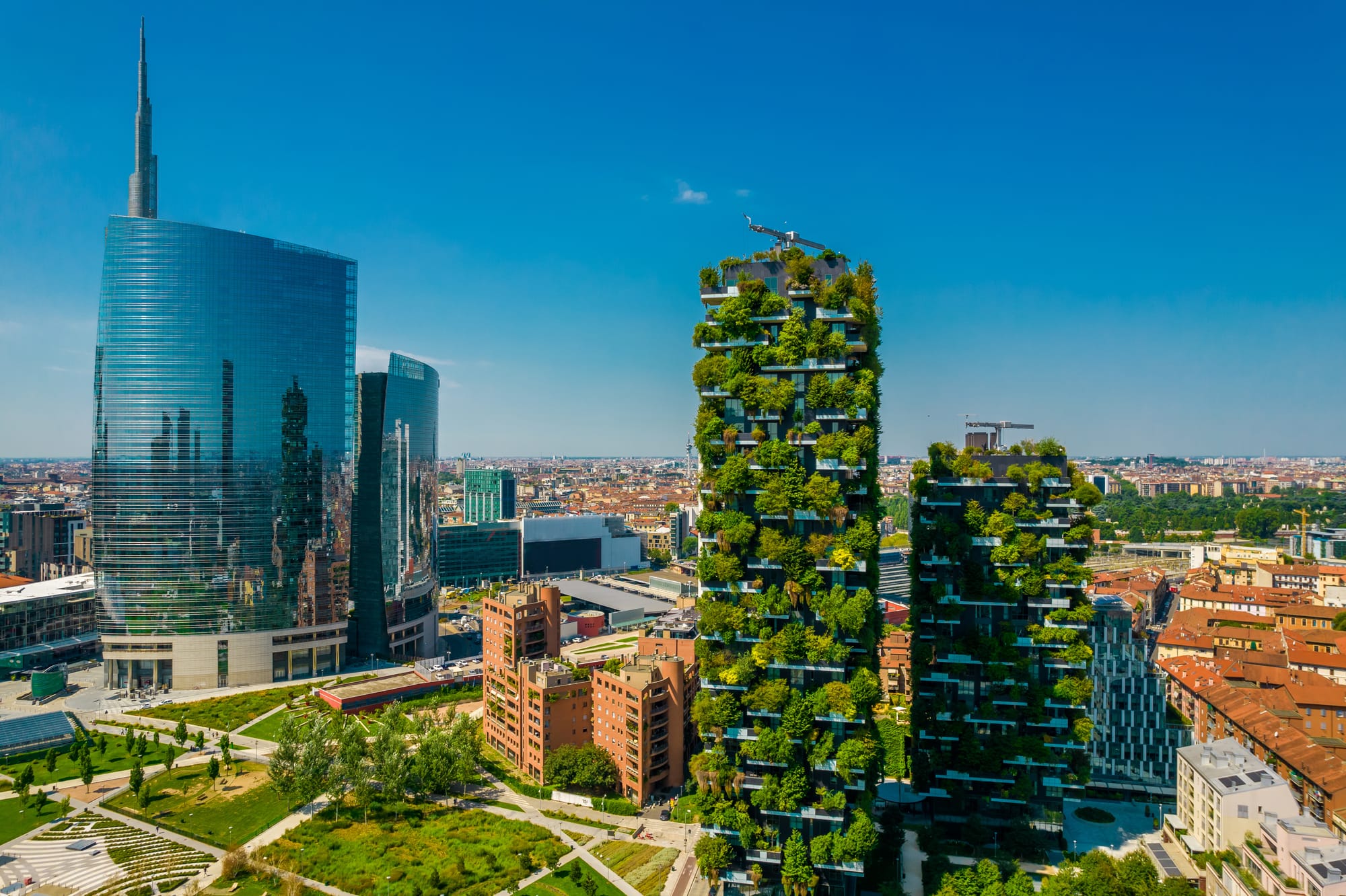 The innovative Bosco Verticale (Vertical Forest) towers in Milan's Porta Nuova district, showcasing modern sustainable architecture with trees and shrubs on every balcony.