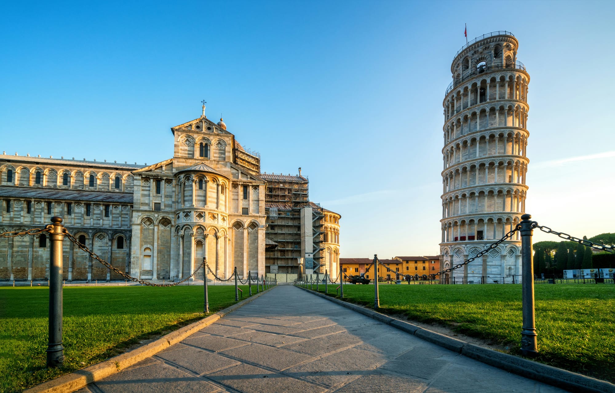 The Leaning Tower and the Duomo in Pisa's Piazza dei Miracoli, a must-see art destination in Tuscany, Italy.